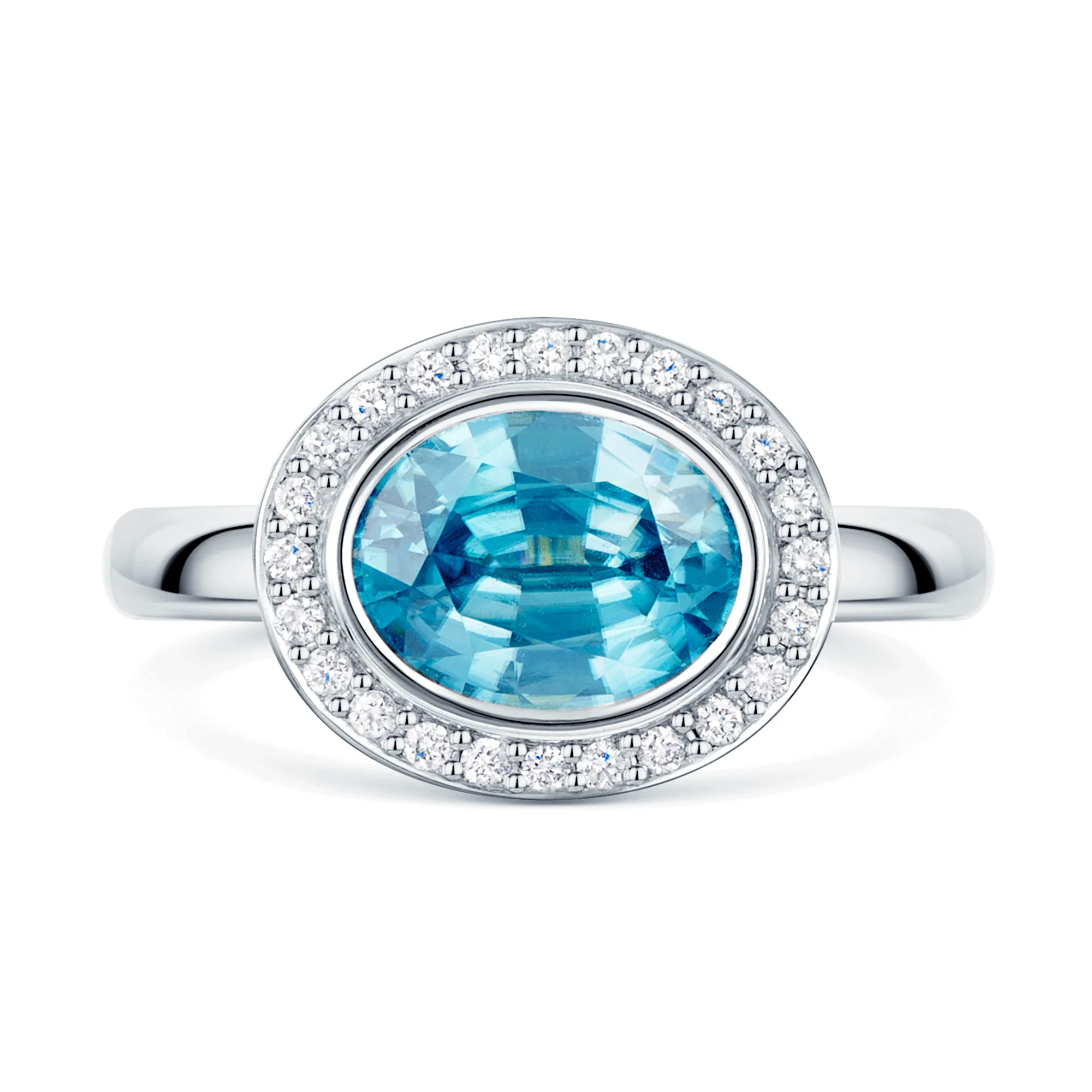 18ct White Gold Oval Cut Blue Zircon And Round Brilliant Diamond Rub Over Halo Dress Ring - Image 2