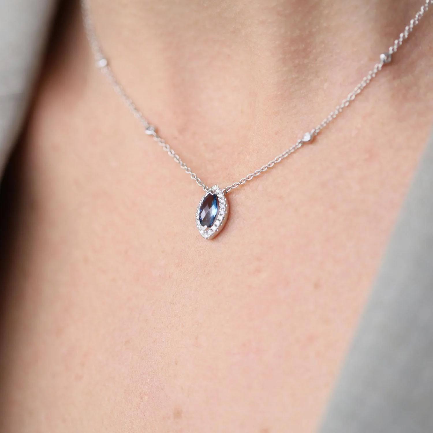 18ct White Gold Marquise London Blue Topaz And Diamond Halo Pendant With Diamonds On The Chain - Image 3