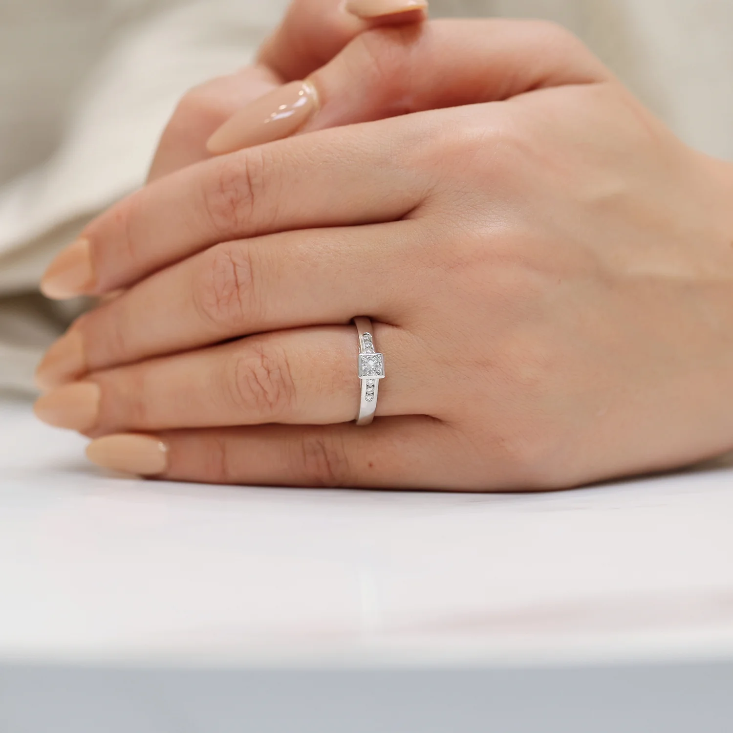 18ct White Gold Princess Cut Diamond Rub Over Set Solitaire Ring With Round Brilliant Cut Channel Set Diamond Shoulders - Image 2