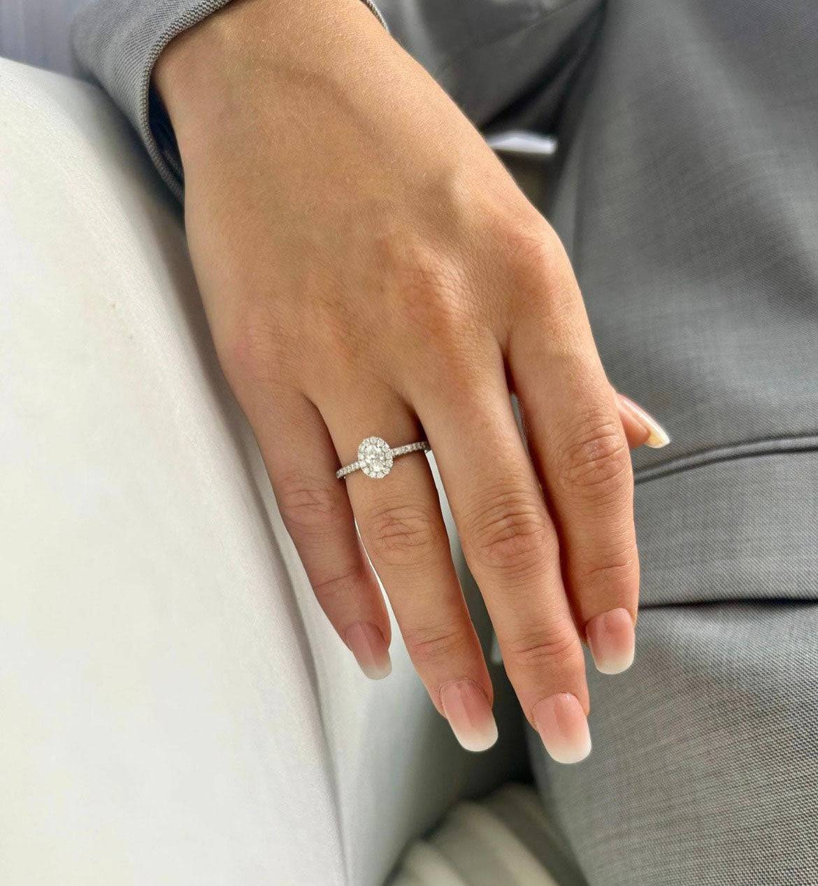 Platinum and Oval Cut Diamond Halo Ring With Round Brilliant Diamond Shoulders - Image 2