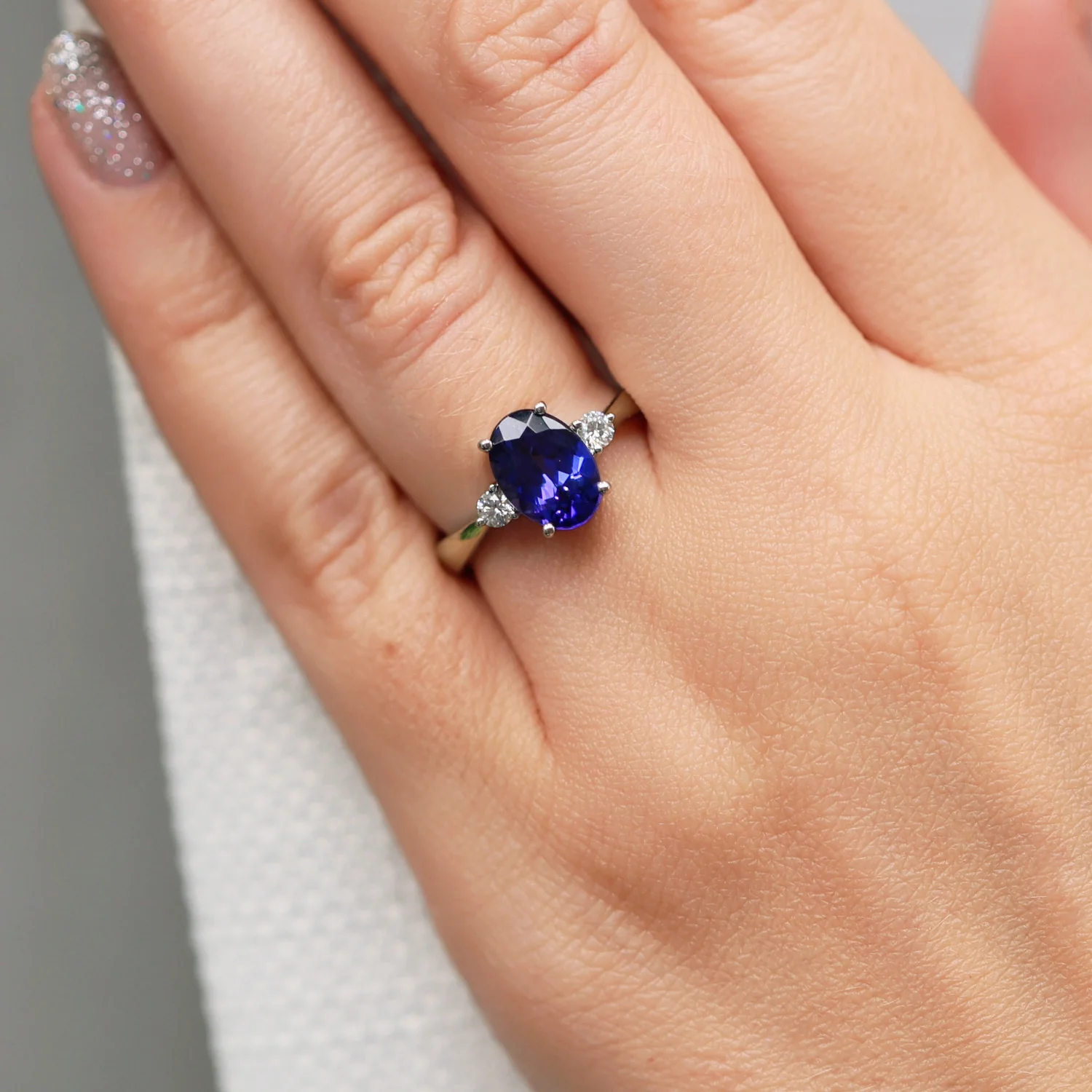 Platinum Oval Cut Tanzanite And Round Brilliant Three Stone Ring - Image 2