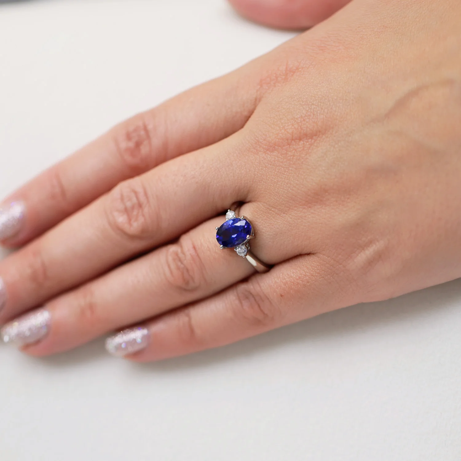Platinum Oval Cut Tanzanite And Round Brilliant Three Stone Ring - Image 3