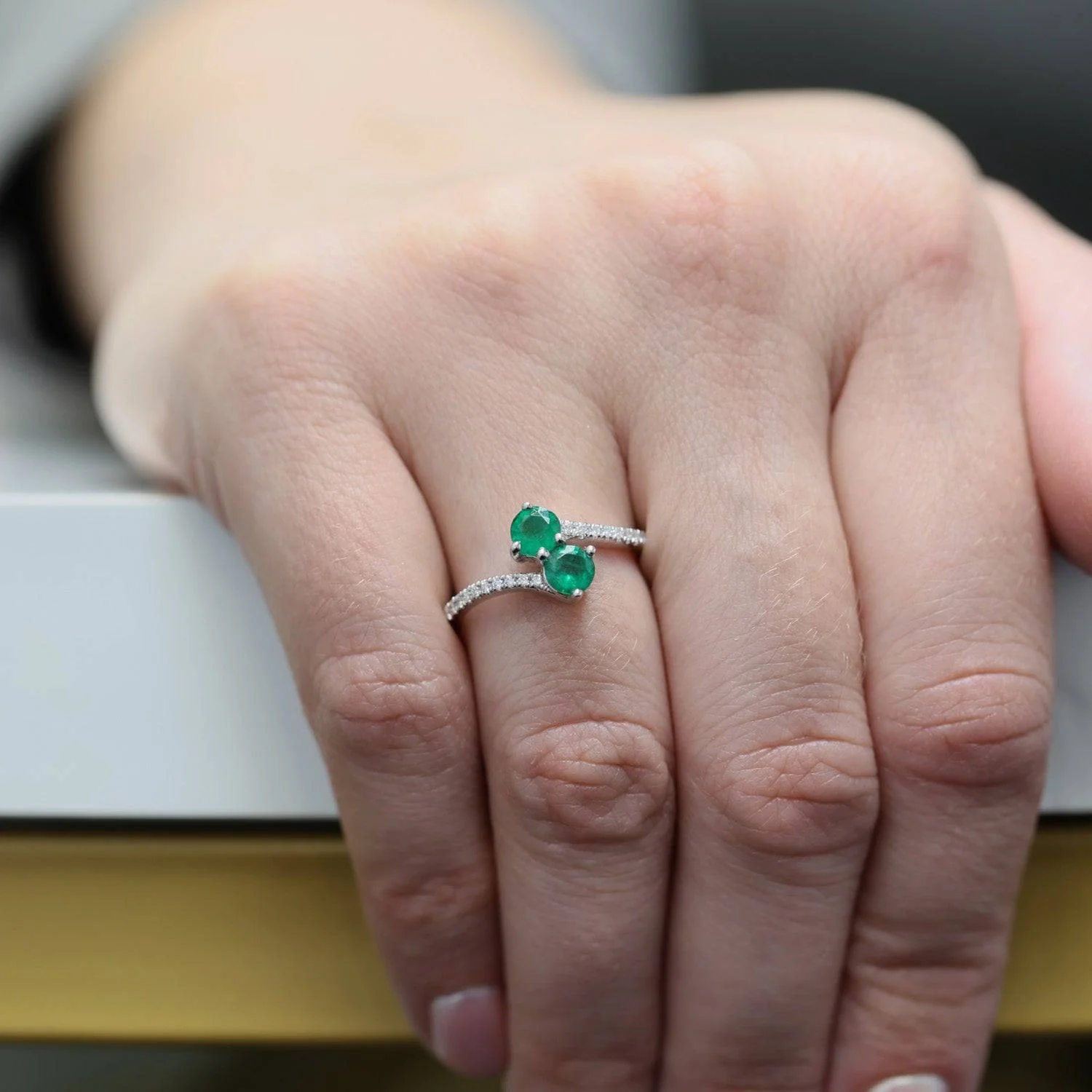 Platinum Round Brilliant Cut Emerald Two Stone Twist Ring With Diamond Set Shoulders - Image 3