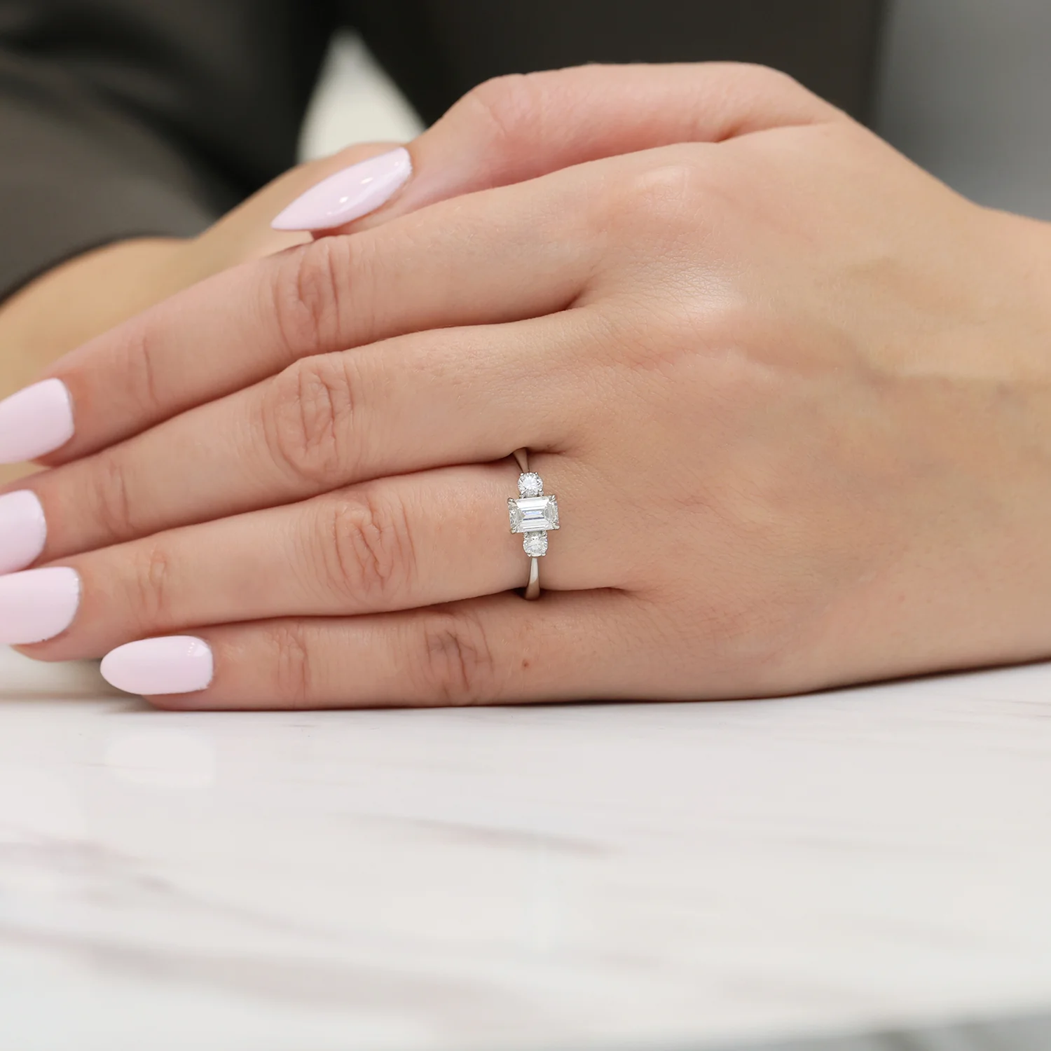 Platinum Emerald Cut And Round Brilliant Cut Diamond Three Stone Ring - Image 2