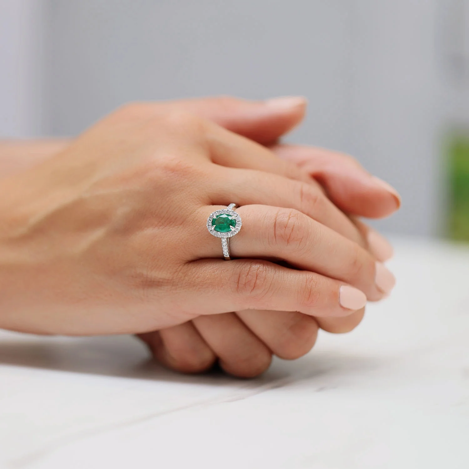 Platinum Oval Cut Emerald And Dimond Ring With Diamond Shoulders - Image 2