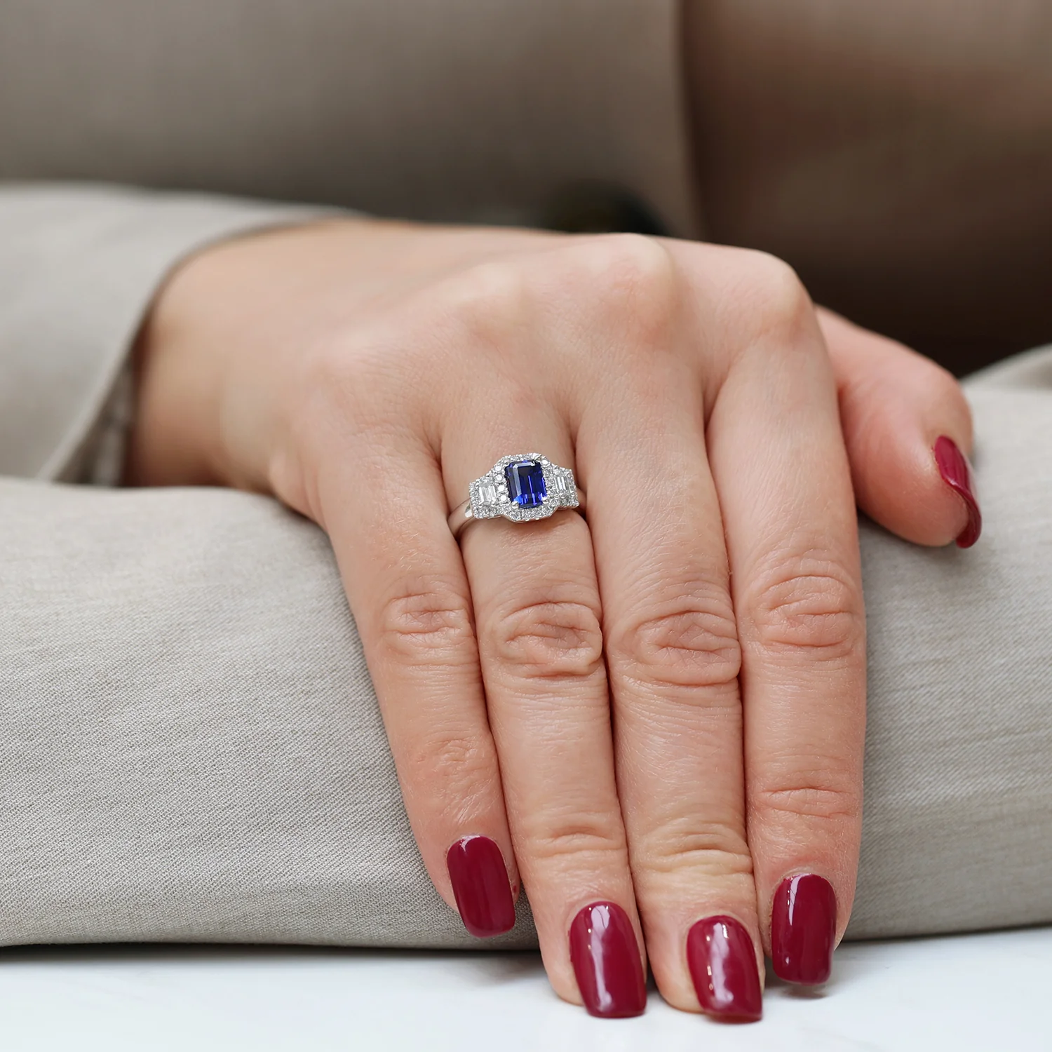 Platinum Sapphire And Baguette Cut Diamond Three Stone Ring With A Halo Surround - Image 3